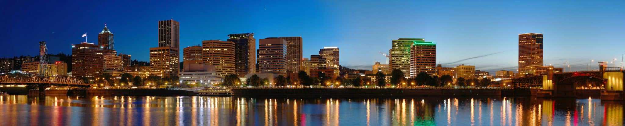 Panorama of downtown Portland at night. View from SE Portland across the Willamette River.