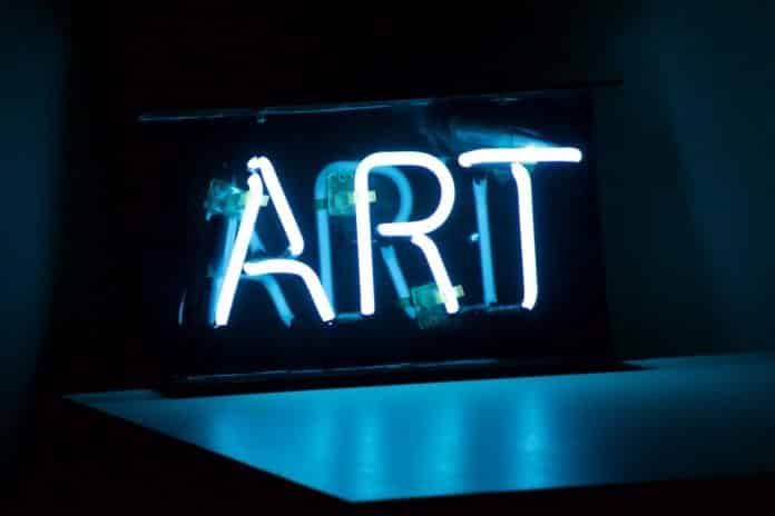 Blue Neon sign that says Art.