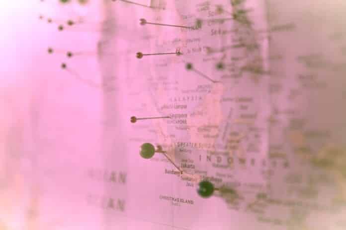 A pink map marked with pins.