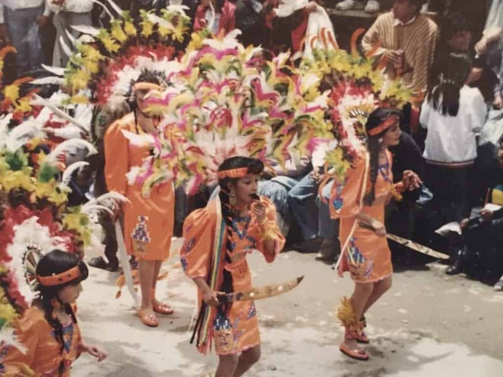 Procession of indigenous people in South America.