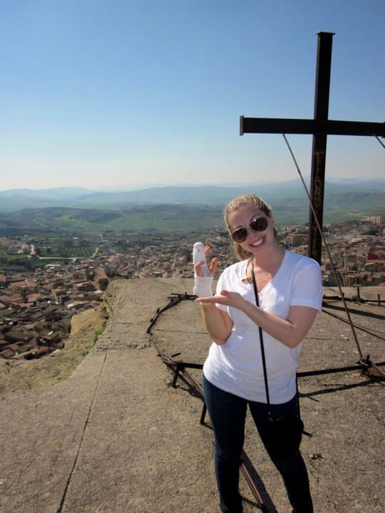 Lucia with a bandaged hand in Corleone, Italy.