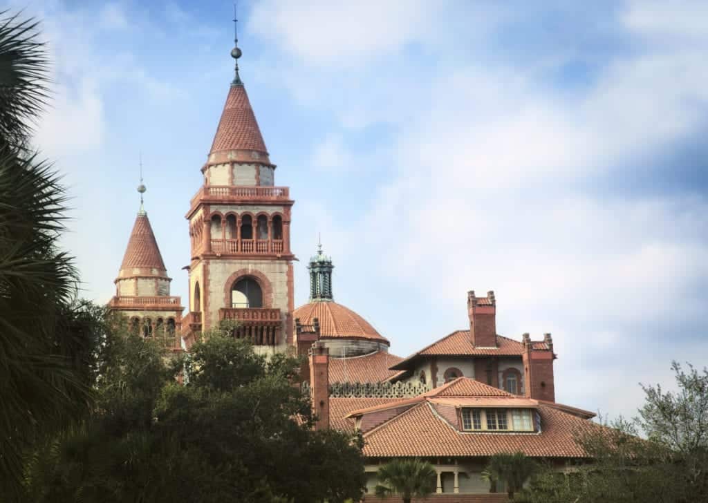 Spanish style towers and tiled roofs of historical St. Augustine building.