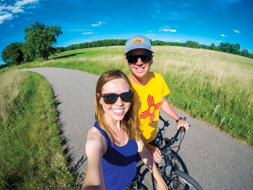 Jenna and Micah Kvidt pedaling on the bike look trail at Glendalough State Park.