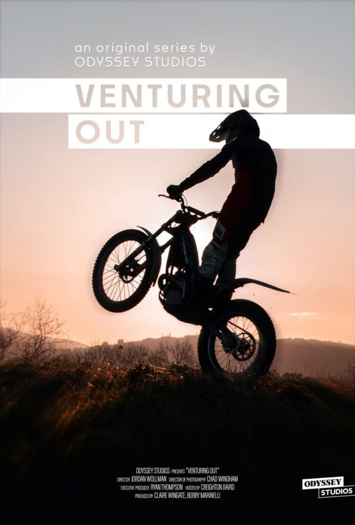 A silhouetted figure performs a wheelie on a dirt bike against a sunset backdrop. Text on the image reads Venturing Out, an original series by Odyssey Studios, with production credits listed below.