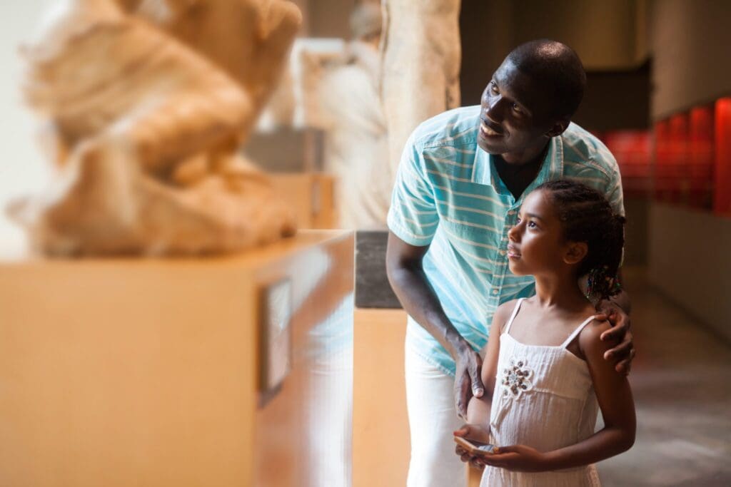 A father and daughter at a museum