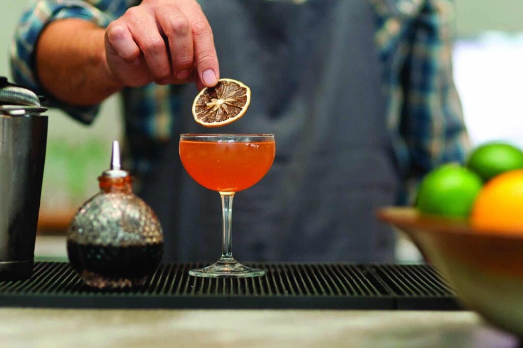 Whiskey cocktail with plum and toasted rice matcha from Oseyo.