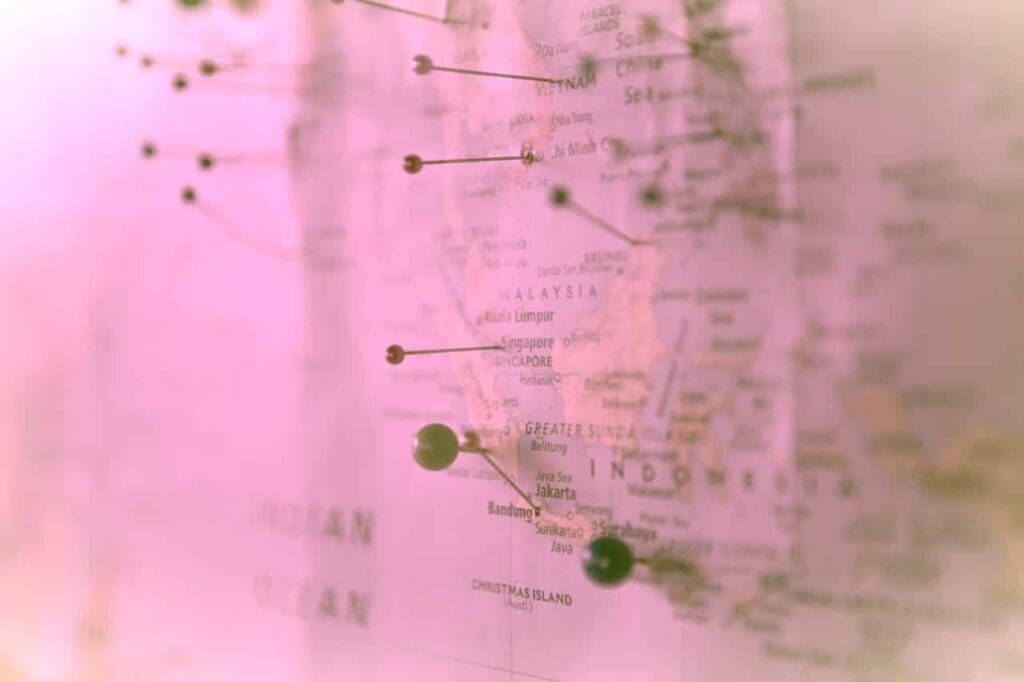A pink map marked with pins.