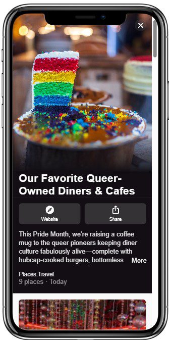 A slice of rainbow layer cake topped with rainbow sprinkles sits on a coffee mug in a café, promoting queer-owned diners and cafés for Pride Month.