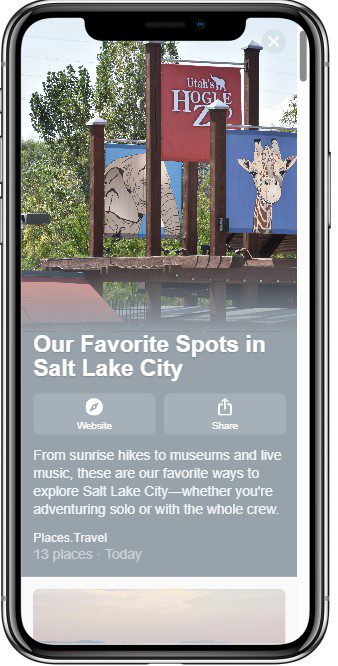A smartphone screen displays an article titled Our Favorite Spots in Salt Lake City with a photo of a wooden entrance sign featuring animal illustrations and the words Utahs Hogle Zoo against a sunny backdrop.
